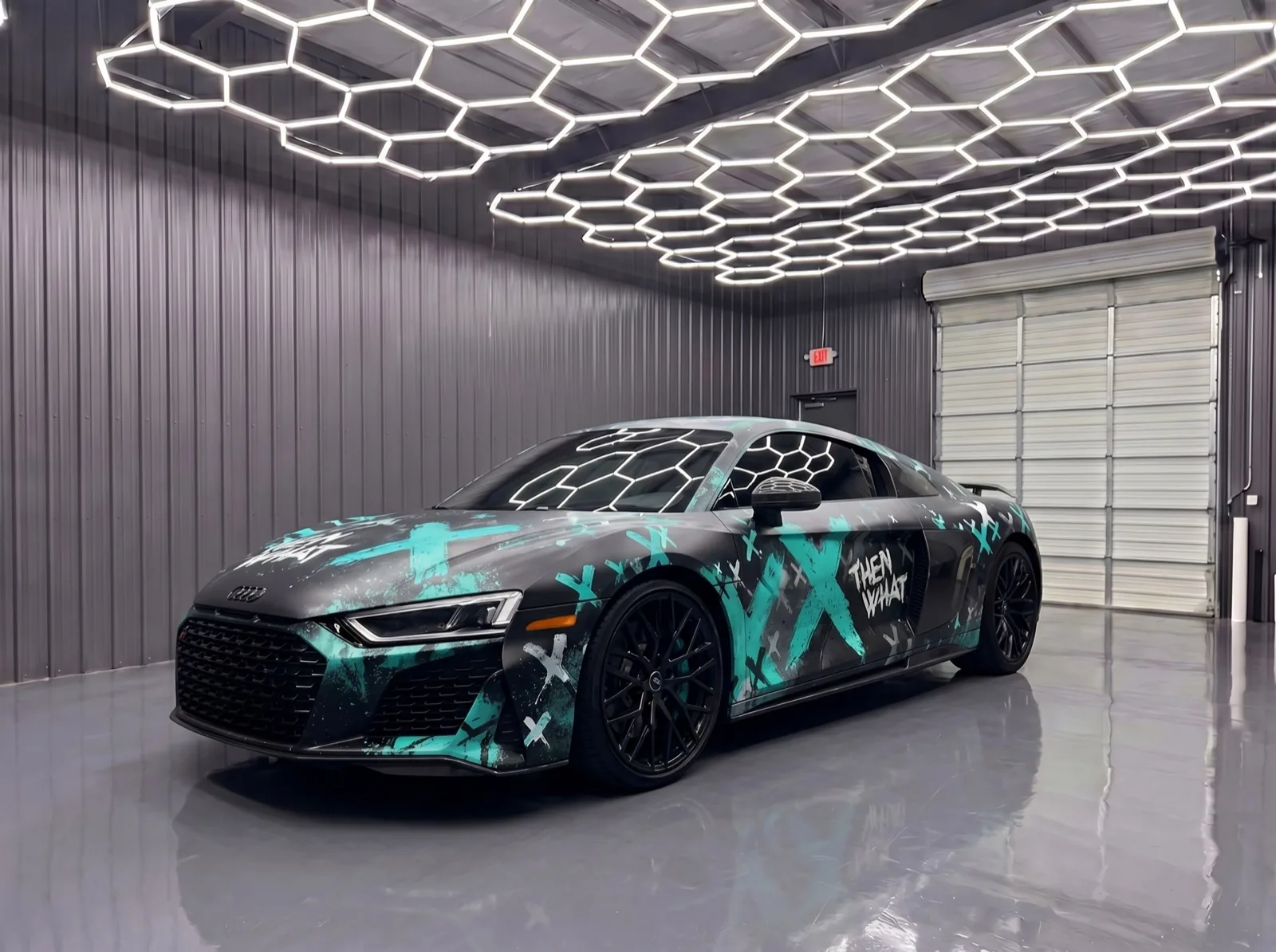 Audi R8 with a hyper teal street-art custom car wrap